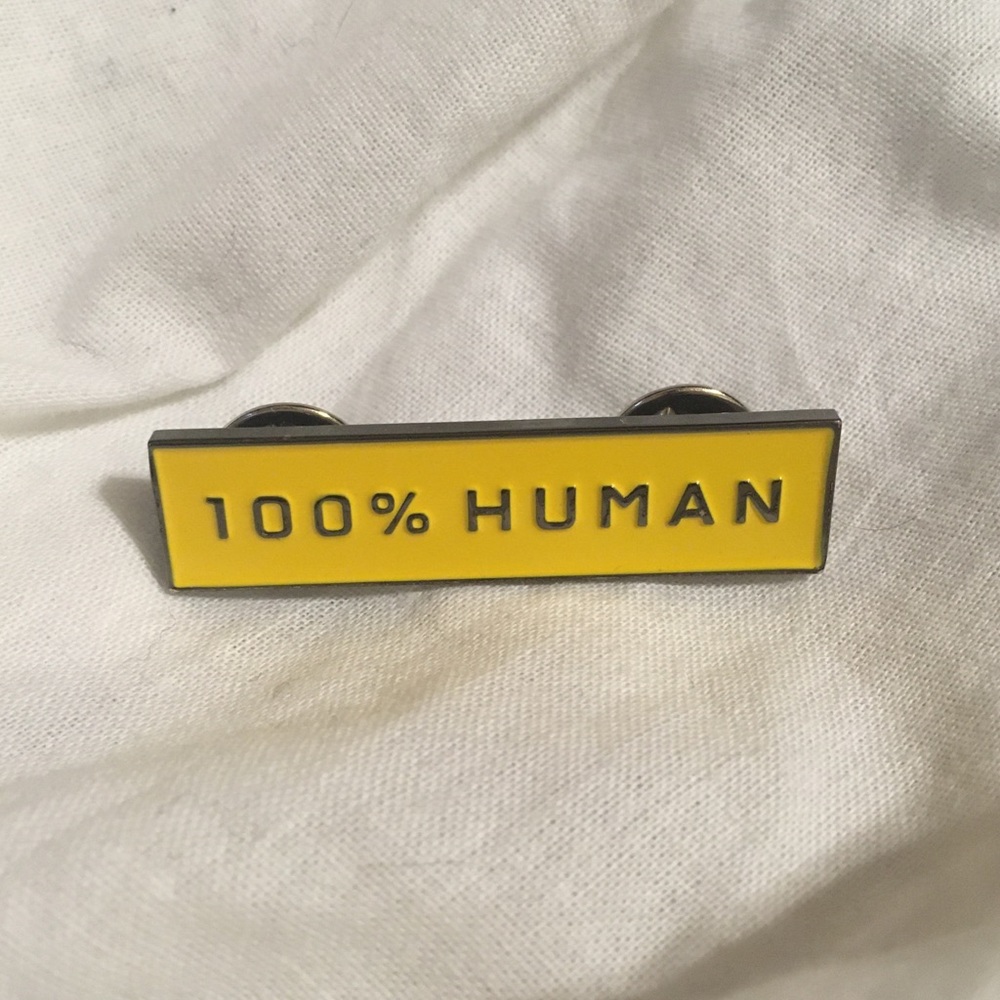 Everlane 100% Human pin in yellow